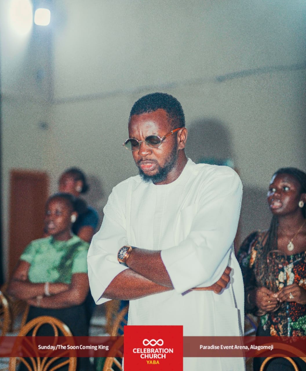 A member standing in worship